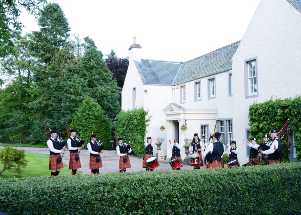 Pipers at front of Elsick House